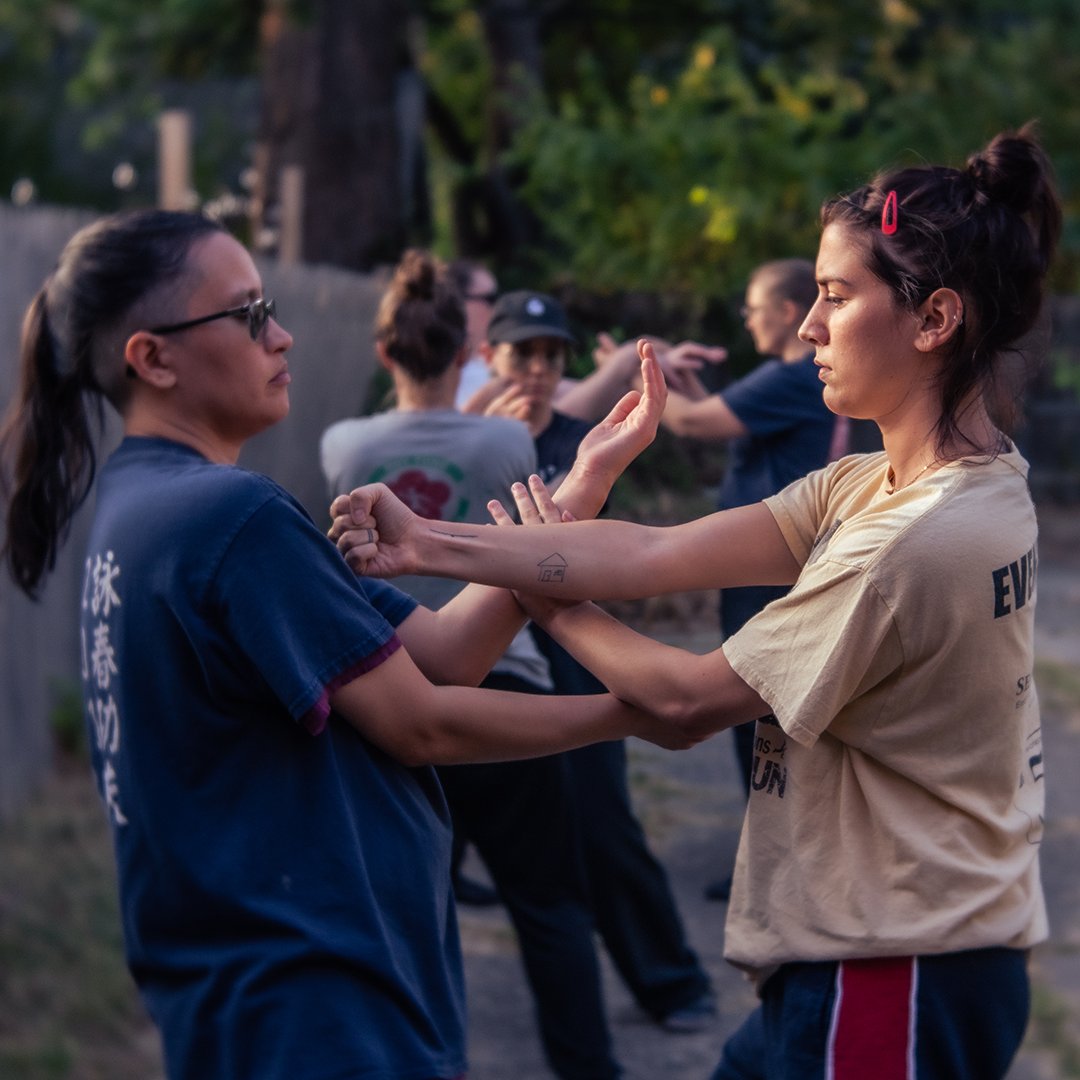 Students practicing chi sao at the Women's Seminar with Grandmaster Moy Tung